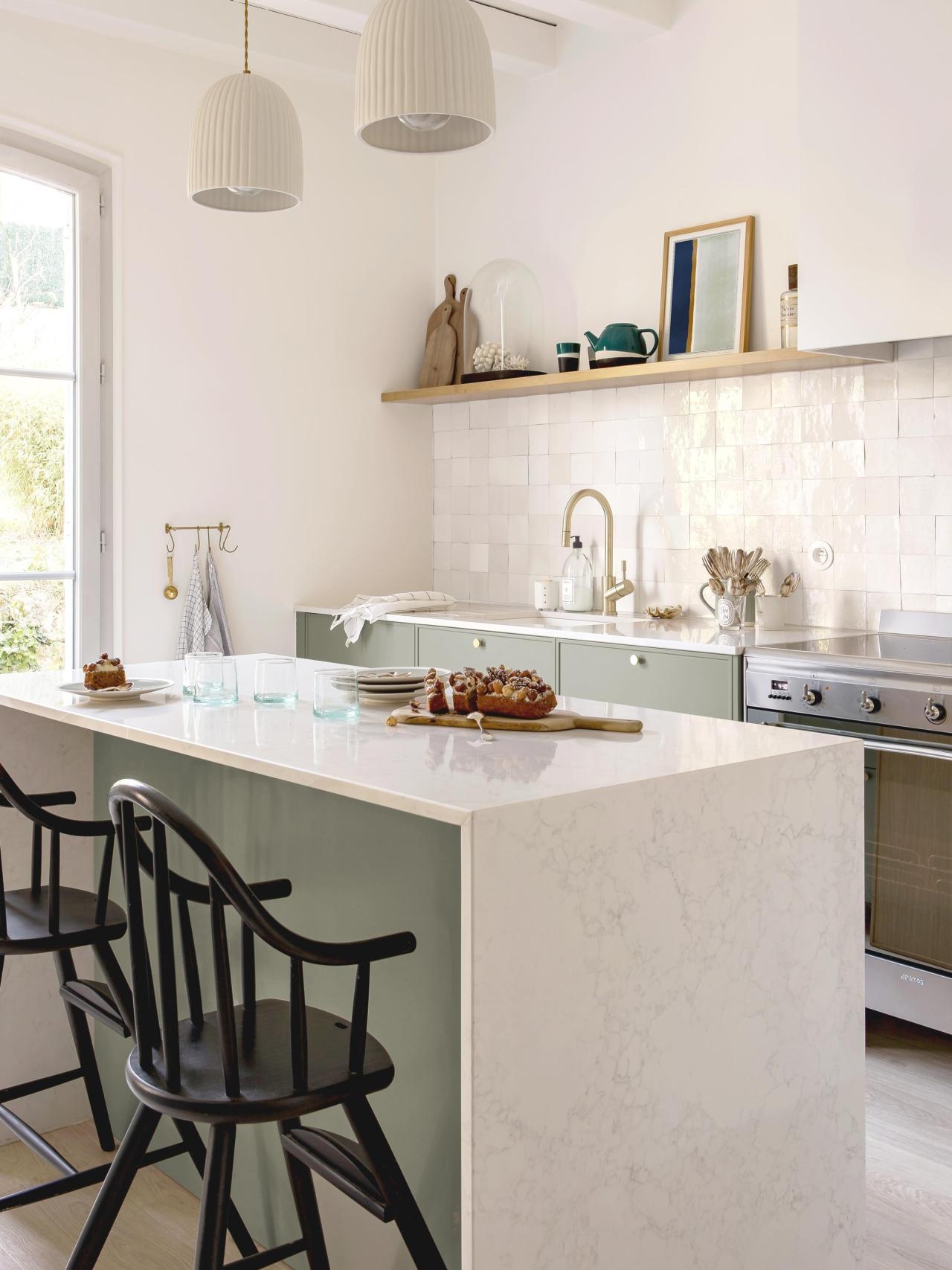 Green frame kitchen with brass details and zellige backsplash