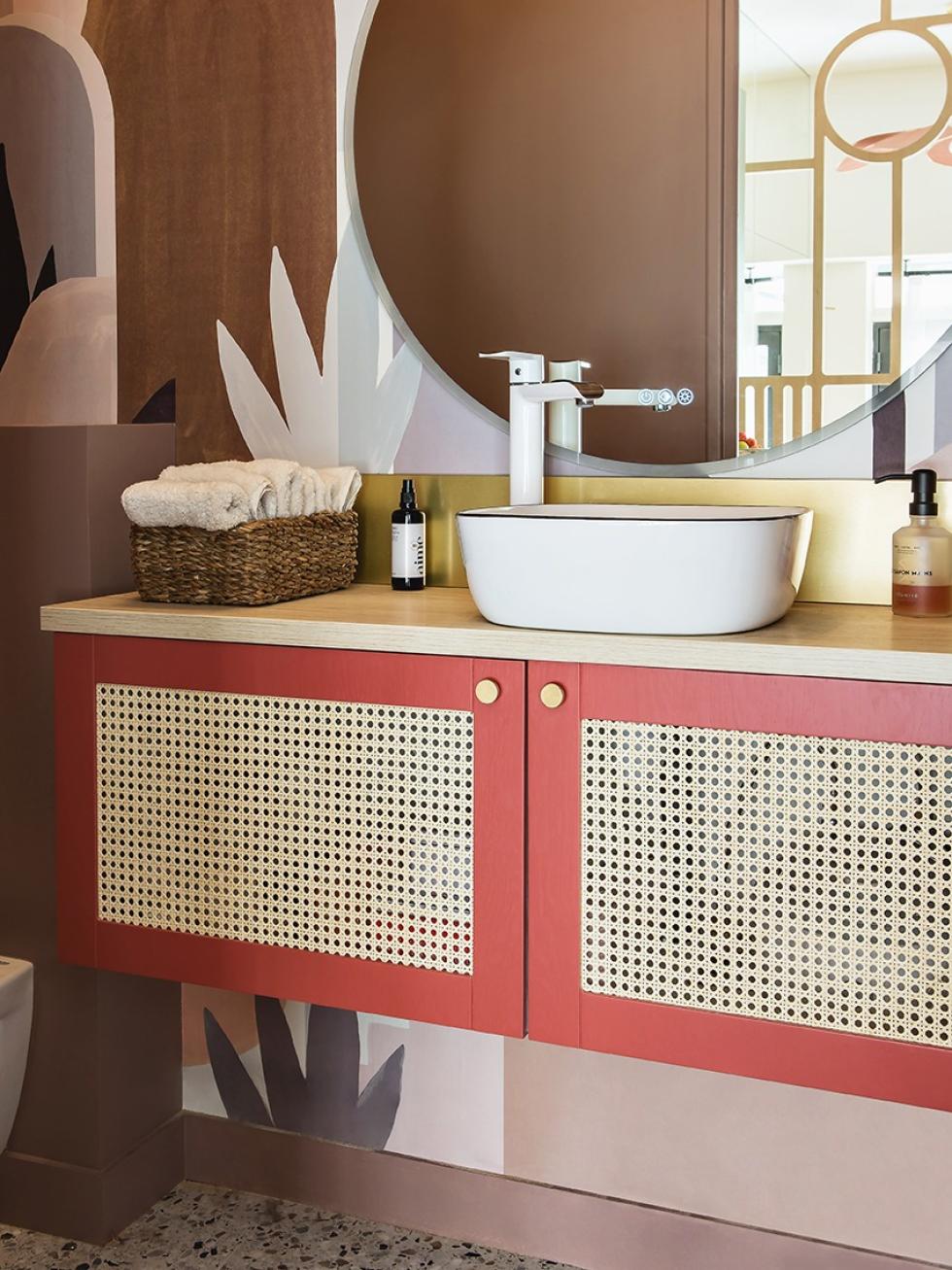 Hanging bathroom cabinet with wicker fronts and brass credenza
