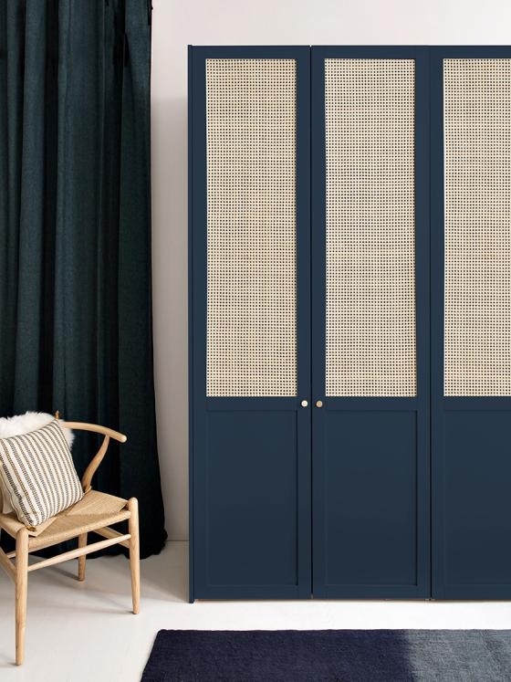 A wardrobe in cane and painted oak
