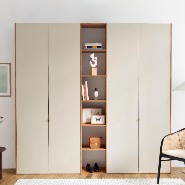 A wardrobe with 4 doors and compartments.