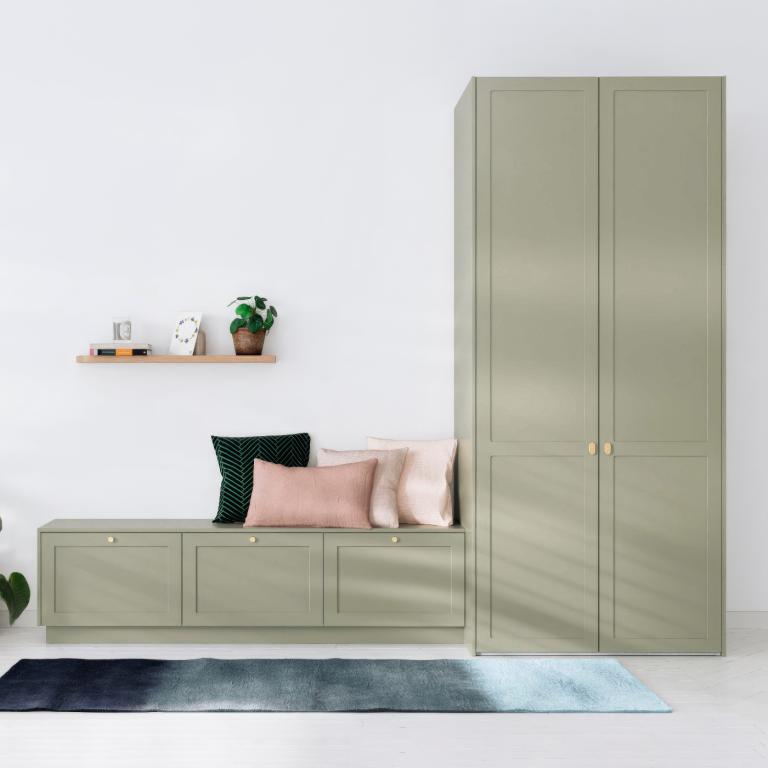 A wardrobe with a bench that combines two different materials.